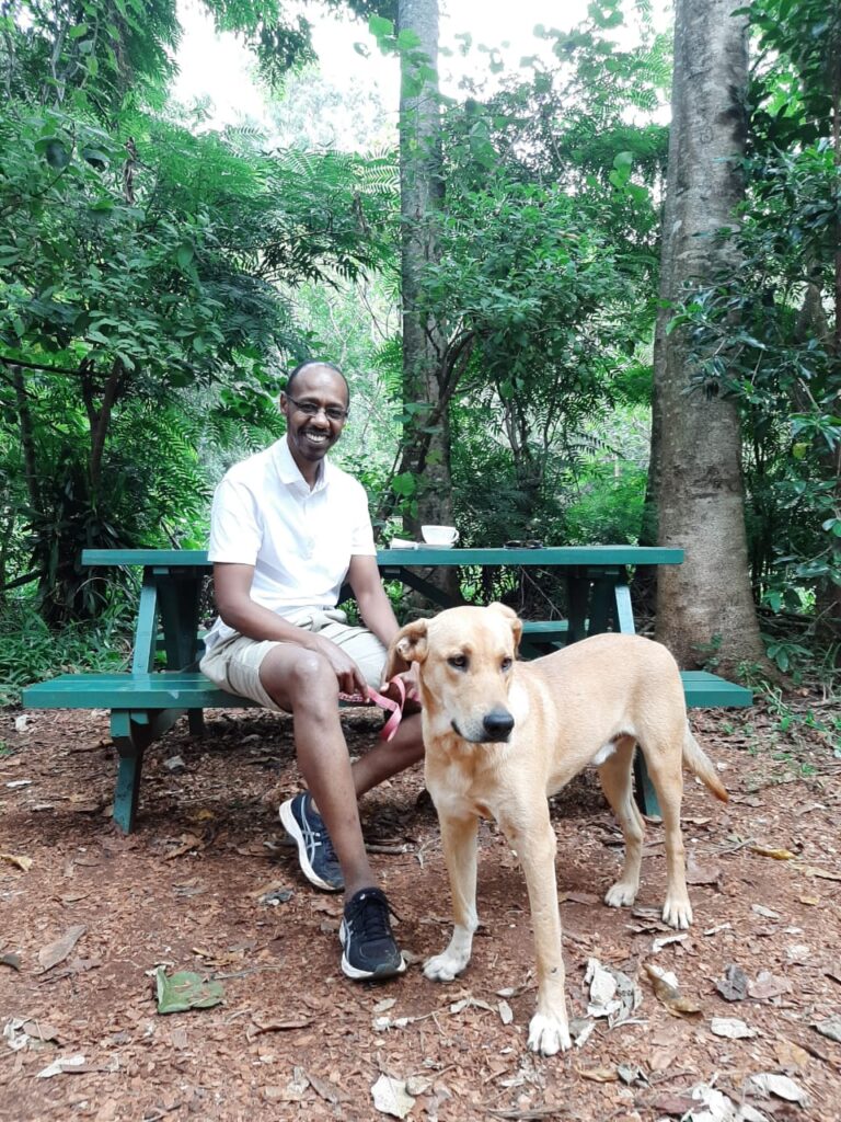 Kim Kanari with his dog Chaka in Karura Forest